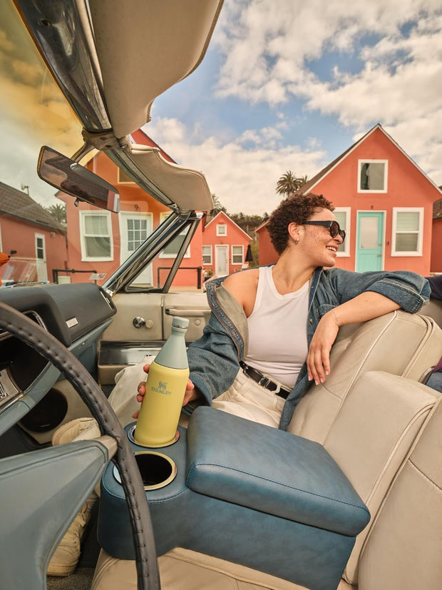 Stanley All Day Slim Bottle 34 oz | Twist off Lid with Leakproof Seal | Slim Design for Travel and Gym | Insulated Stainless Steel Water Bottle | BPA-Free | Garnet Shine